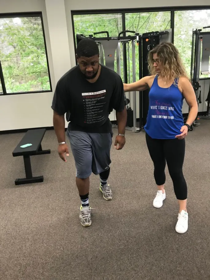 Bill McCallister coaching a client through gait and balance retraining in the studio